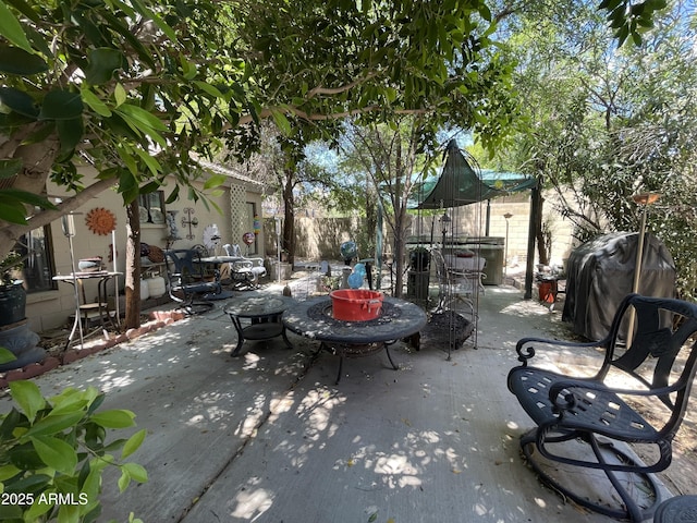 view of patio with fence and area for grilling