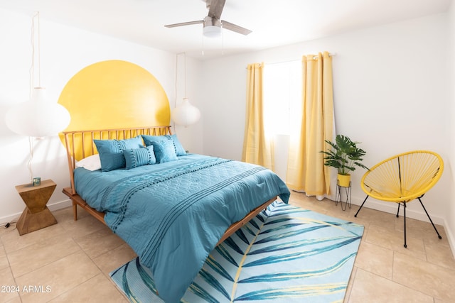 tiled bedroom with ceiling fan