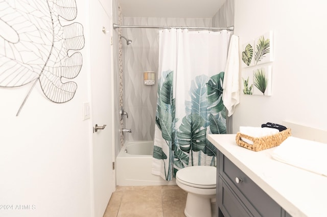 full bathroom with tile patterned floors, vanity, shower / tub combo, and toilet