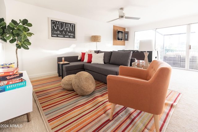 living room with carpet flooring and ceiling fan