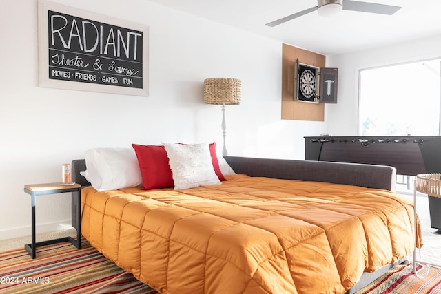 bedroom featuring ceiling fan and carpet floors