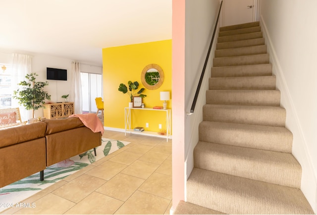 stairs featuring tile patterned flooring