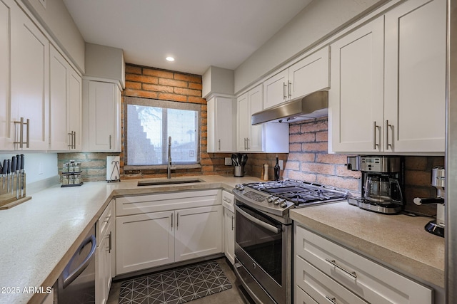 kitchen featuring sink, gas range, tasteful backsplash, dishwasher, and white cabinets