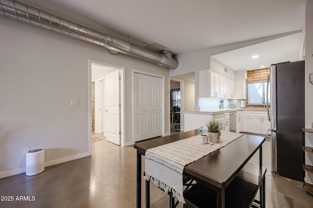 dining room featuring concrete floors