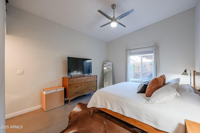 bedroom featuring ceiling fan, lofted ceiling, and concrete floors