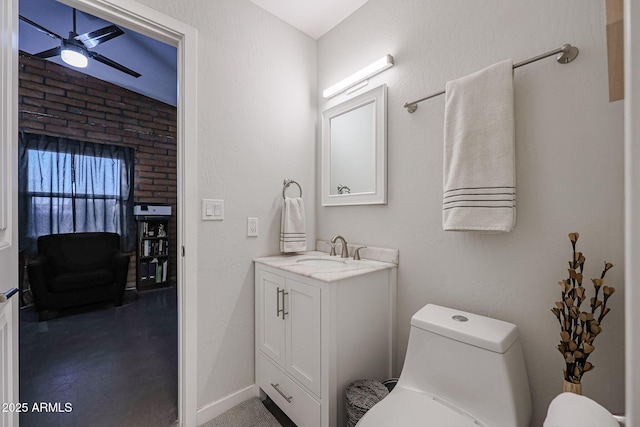 bathroom with vanity, toilet, and ceiling fan