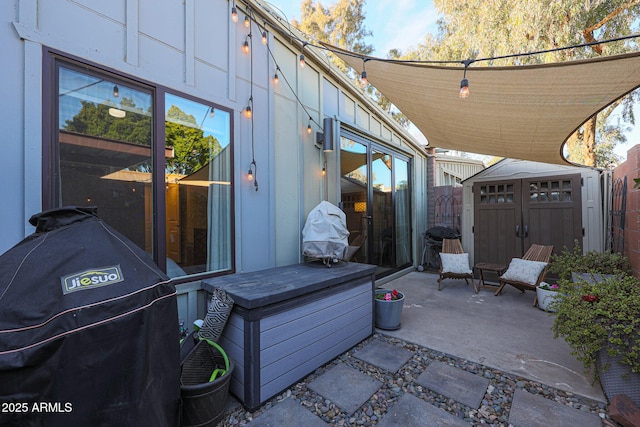 view of patio / terrace featuring a storage unit