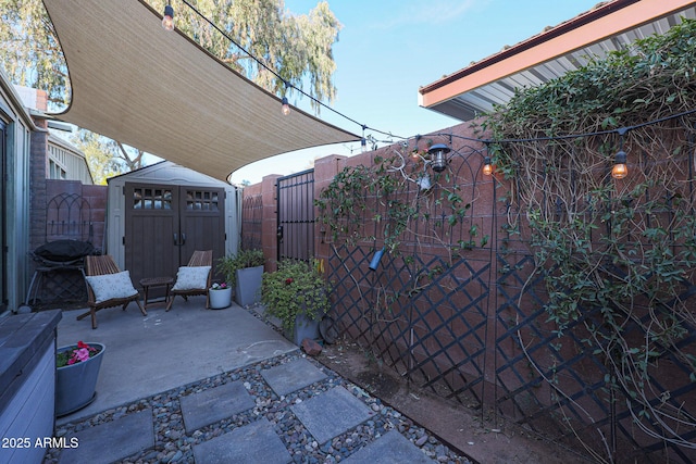 view of patio / terrace featuring a storage unit