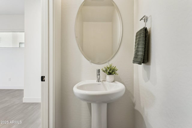 bathroom featuring wood finished floors