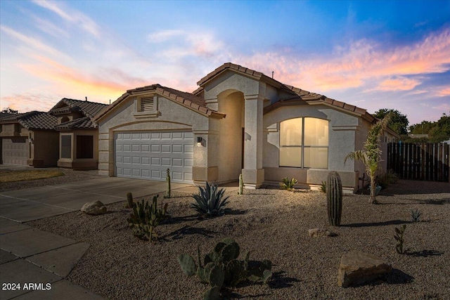 view of front of property featuring a garage