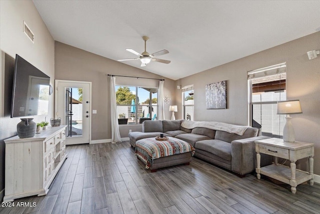 living room with hardwood / wood-style flooring, ceiling fan, and lofted ceiling