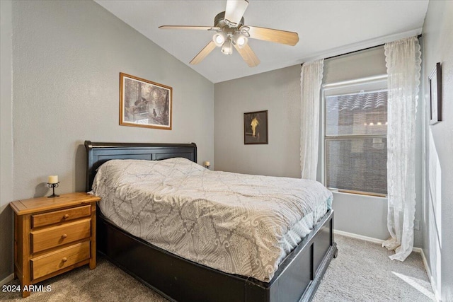 carpeted bedroom featuring ceiling fan and lofted ceiling