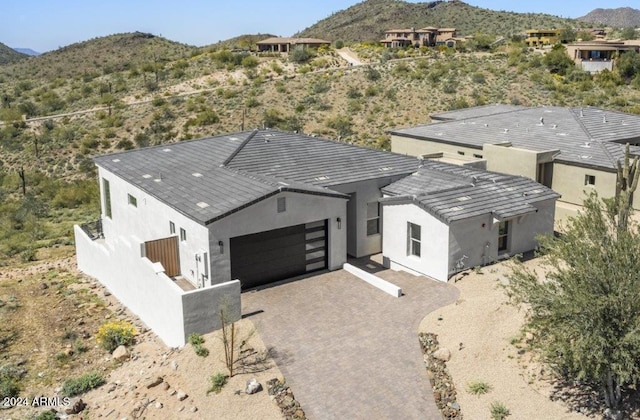 birds eye view of property featuring a mountain view