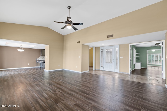 2461 Leisure World, Mesa, AZ 85206 - unfurnished living room with dark wood-type flooring, high vaulted ceiling, ceiling fan, and visible vents