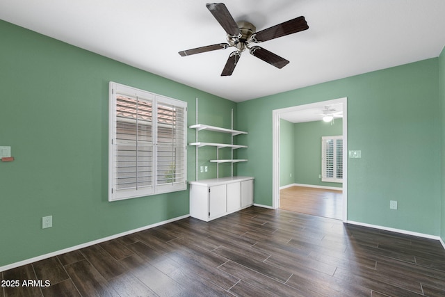 2461 Leisure World, Mesa, AZ 85206 - spare room with ceiling fan, baseboards, and dark wood finished floors