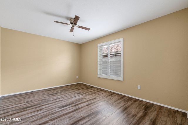 2461 Leisure World, Mesa, AZ 85206 - empty room with ceiling fan, baseboards, and wood finished floors