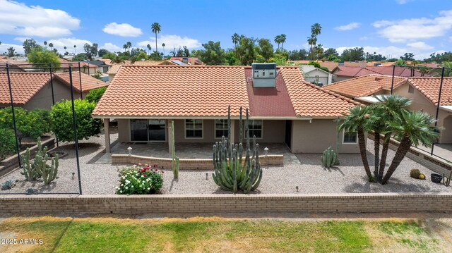 2461 Leisure World, Mesa, AZ 85206 - rear view of property with a patio area, a tiled roof, a residential view, and stucco siding