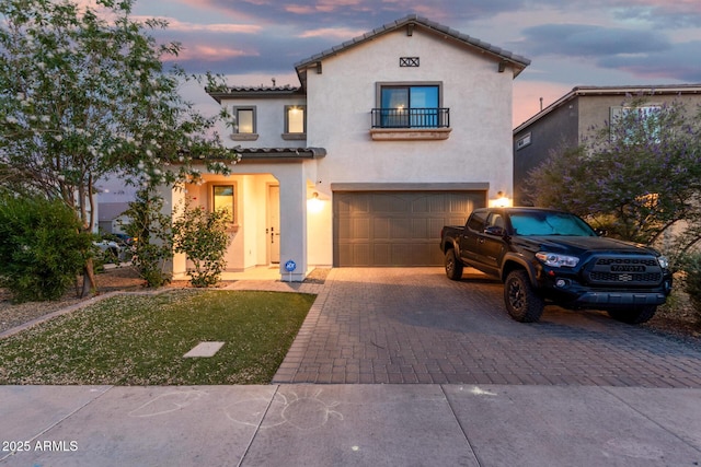 11541 E Corbin Ave, Mesa, AZ 85212 - mediterranean / spanish house with a balcony, stucco siding, driveway, an attached garage, and a tiled roof
