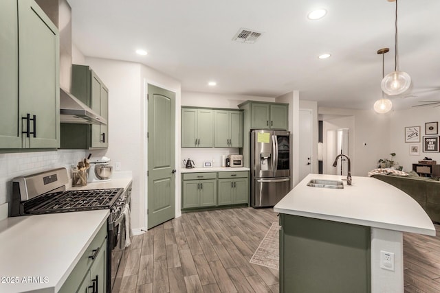 11541 E Corbin Ave, Mesa, AZ 85212 - kitchen with green cabinets, stainless steel appliances, a sink, light countertops, and recessed lighting