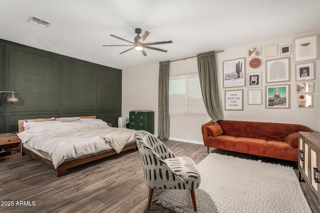11541 E Corbin Ave, Mesa, AZ 85212 - bedroom with wood finished floors, a ceiling fan, and baseboards