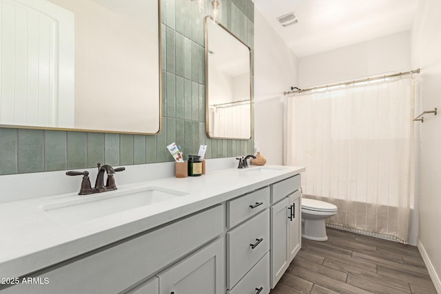 11541 E Corbin Ave, Mesa, AZ 85212 - full bathroom with toilet, double vanity, wood finished floors, and shower / tub combo with curtain