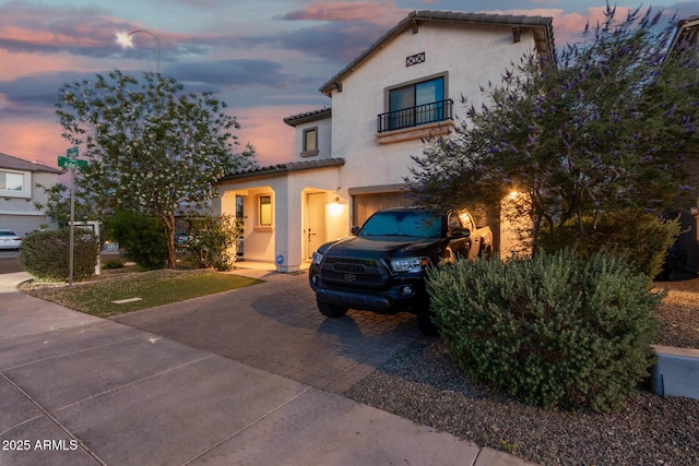 11541 E Corbin Ave, Mesa, AZ 85212 - mediterranean / spanish house featuring decorative driveway, a balcony, stucco siding, and a tile roof
