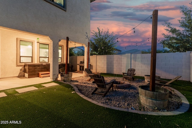 11541 E Corbin Ave, Mesa, AZ 85212 - yard at dusk with a patio area and an outdoor fire pit