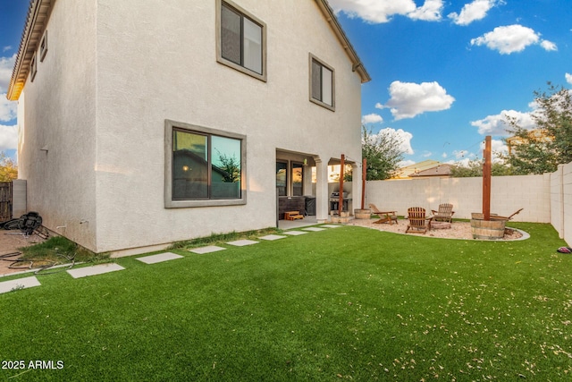 11541 E Corbin Ave, Mesa, AZ 85212 - back of house with stucco siding, a patio, and an outdoor fire pit