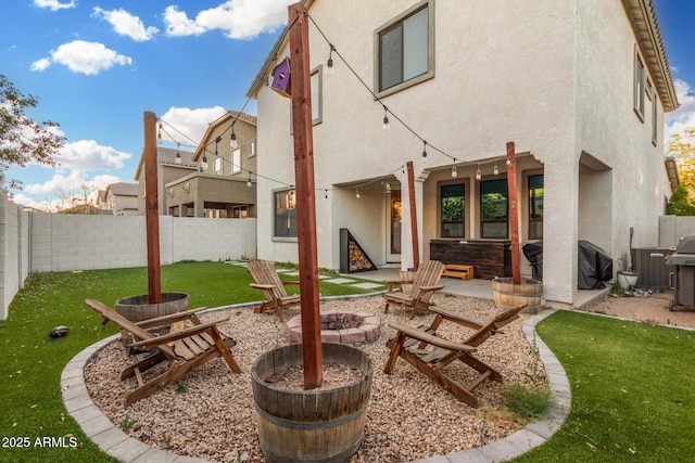 11541 E Corbin Ave, Mesa, AZ 85212 - rear view of house featuring stucco siding, a patio, and a fire pit