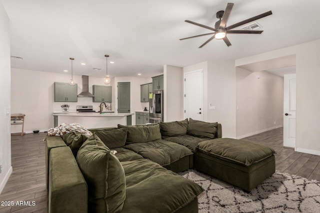 11541 E Corbin Ave, Mesa, AZ 85212 - living area featuring baseboards, a ceiling fan, wood finished floors, and recessed lighting