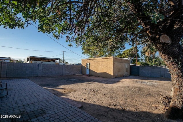 view of yard featuring a patio area and a fenced backyard