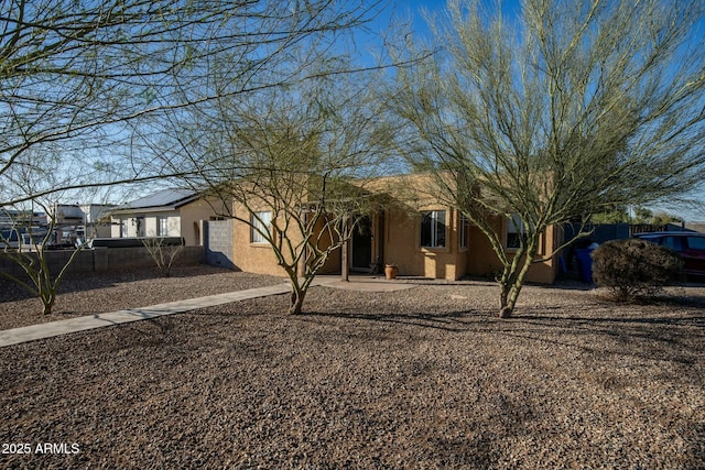 ranch-style home with stucco siding