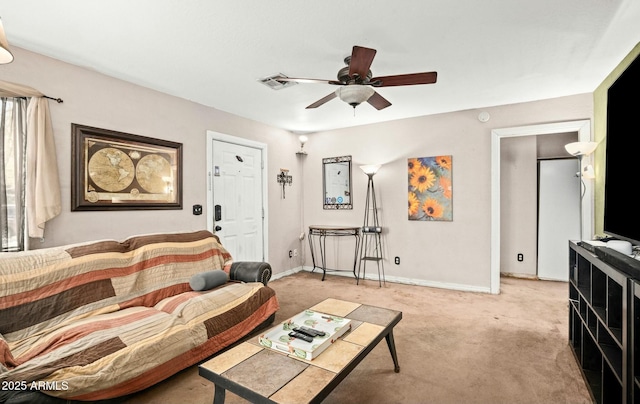 living room featuring light carpet, baseboards, visible vents, and a ceiling fan