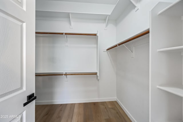 spacious closet with wood finished floors