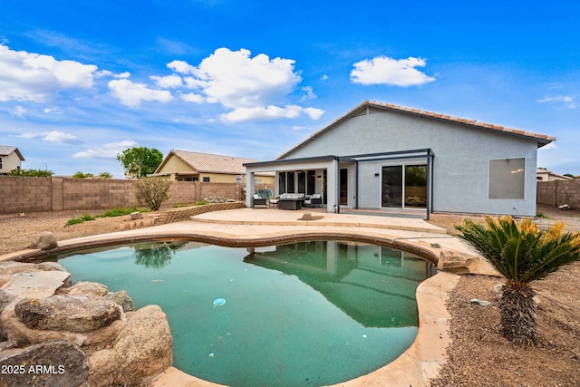 view of swimming pool featuring a fenced in pool, a fenced backyard, and a patio area