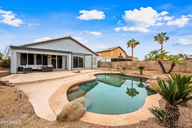 view of swimming pool with a patio area, a fenced in pool, a fenced backyard, and an outdoor hangout area