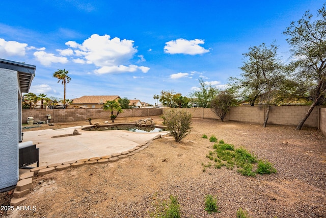 view of yard with a patio and a fenced backyard