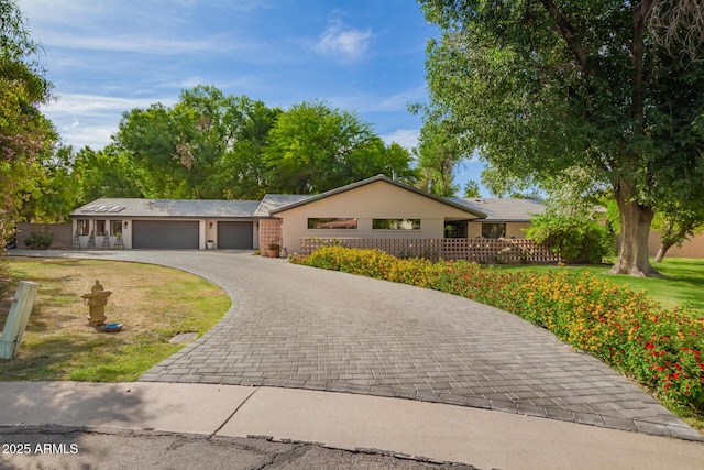8302 S Jentilly Ln, Tempe, AZ 85284 - ranch-style home featuring an attached garage and decorative driveway