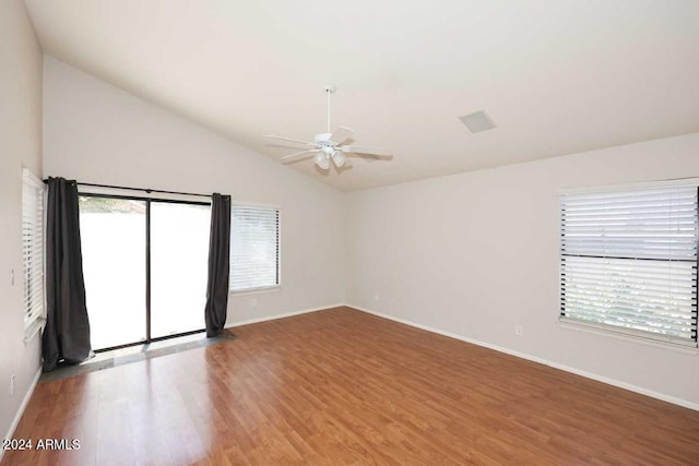 spare room with wood-type flooring, ceiling fan, and lofted ceiling