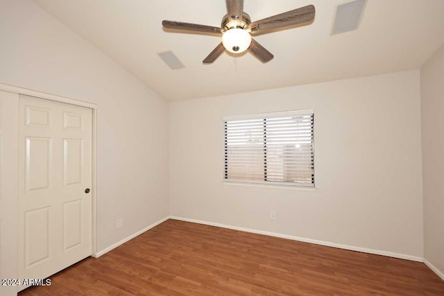 empty room featuring hardwood / wood-style floors, ceiling fan, and lofted ceiling