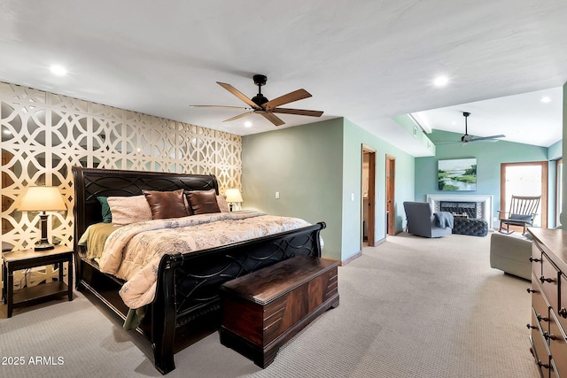 carpeted bedroom with lofted ceiling and ceiling fan