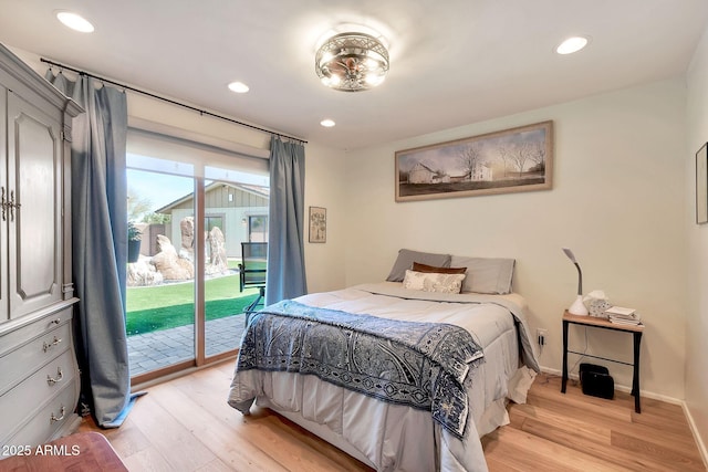 bedroom with access to exterior and light wood-type flooring