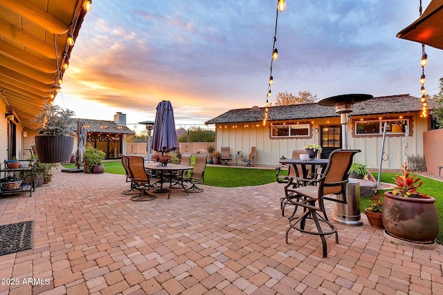 view of patio terrace at dusk