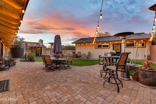 view of patio terrace at dusk