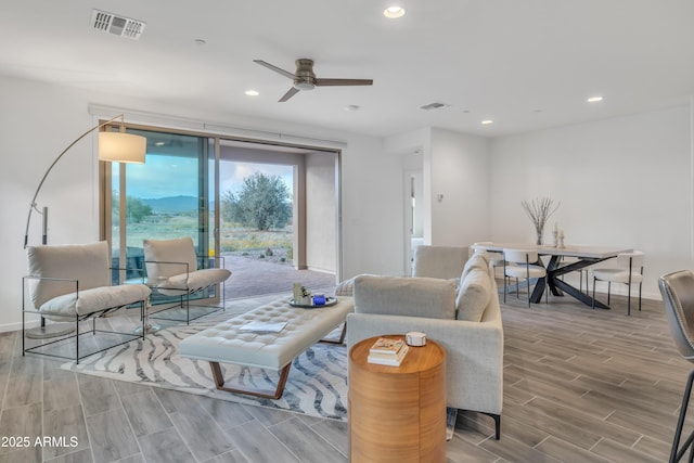 living room featuring recessed lighting, visible vents, ceiling fan, and wood finished floors
