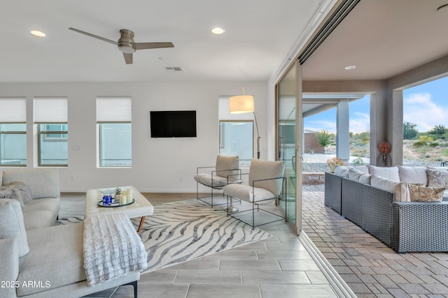 living room featuring recessed lighting, visible vents, baseboards, and ceiling fan