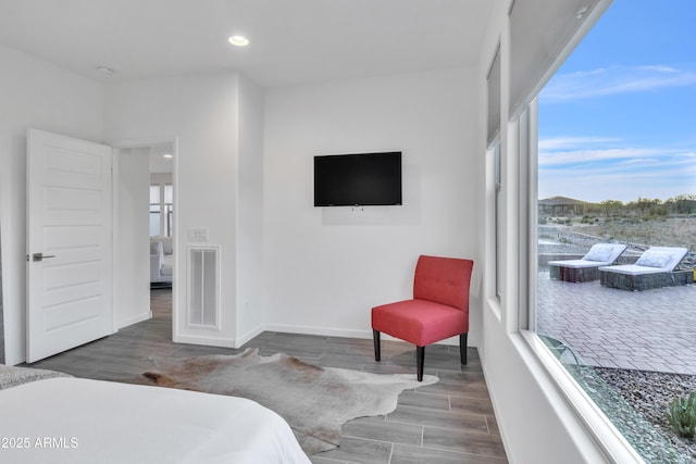 bedroom featuring visible vents, baseboards, recessed lighting, and wood finished floors
