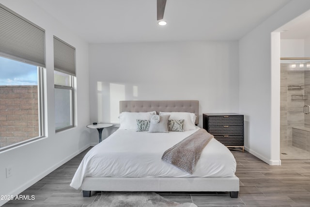 bedroom with recessed lighting, ensuite bath, baseboards, and wood finished floors