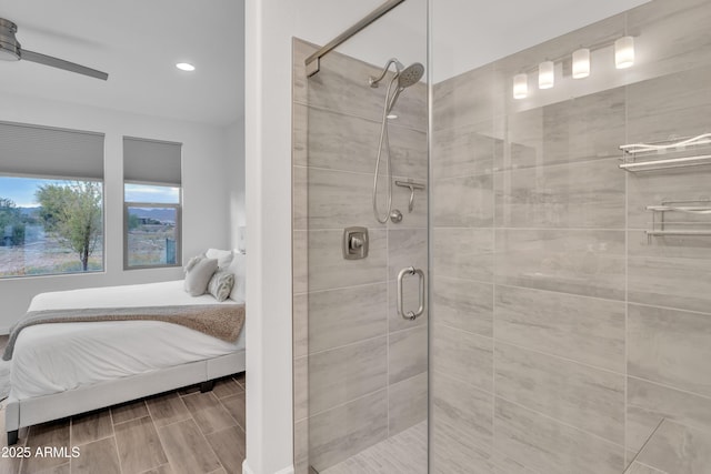 ensuite bathroom featuring a shower stall, connected bathroom, a ceiling fan, and recessed lighting