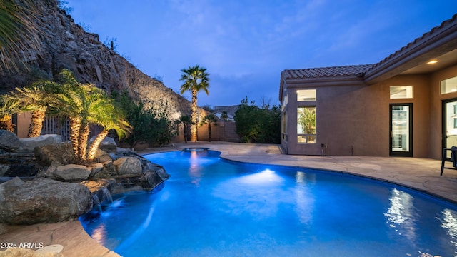 view of swimming pool featuring a fenced in pool, a patio area, and fence